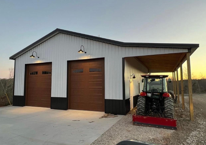 grey farm with yellow tractor in its doors